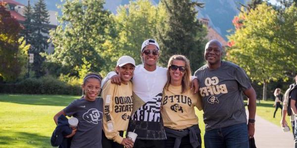 a family at CU Boulder in CU gear